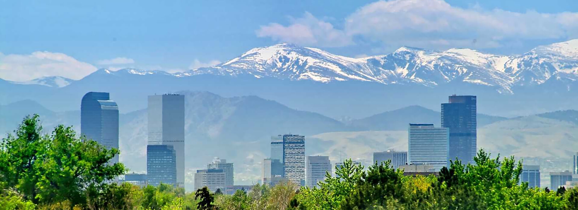 Denver skyline with mountains and trees