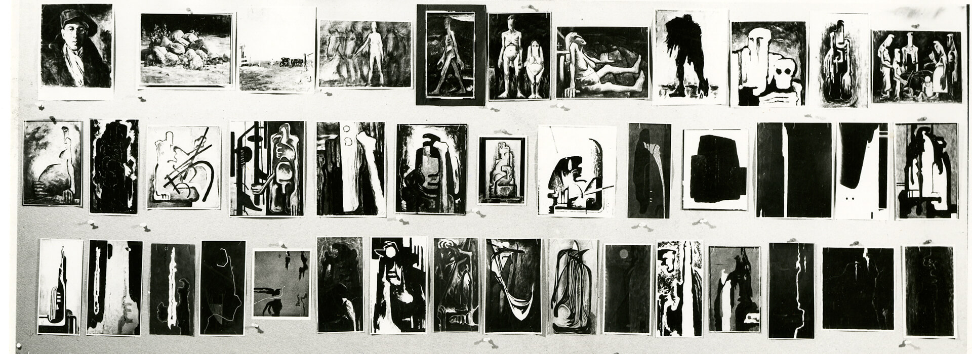 Black and white photo of several artworks by Clyfford Still