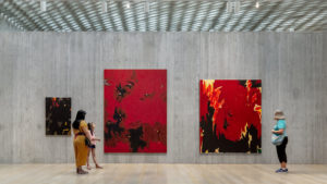 A mom and daughter and another woman explore the Clyfford Still Museum
