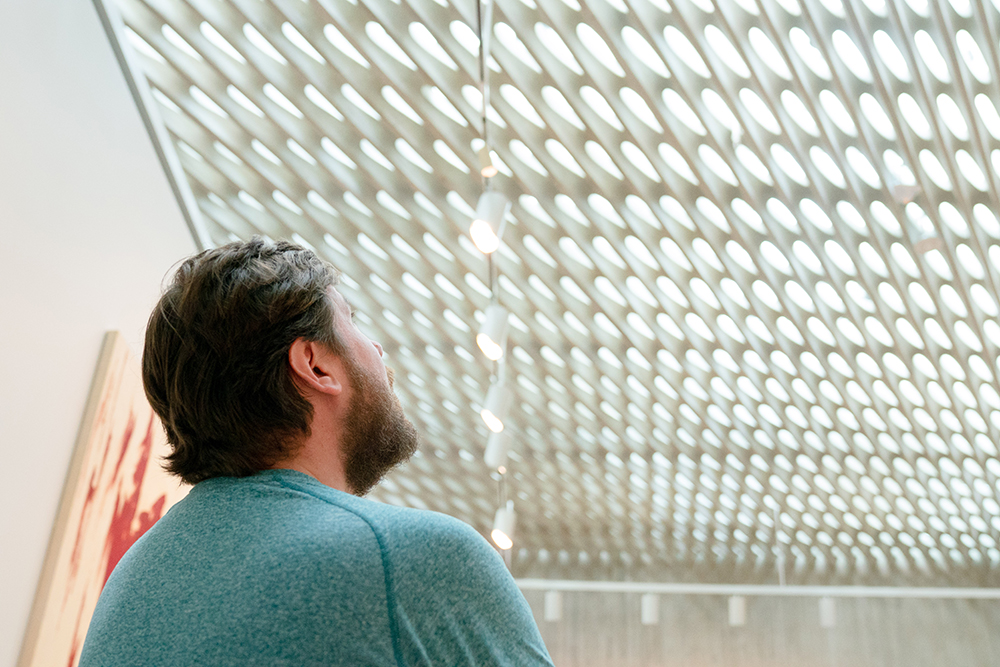 Man looks up at the open ceiling at the Clyfford Still Museum