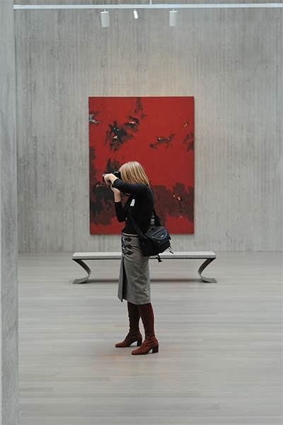 Reporter takes a photo in a gallery at the Clyfford Still Museum
