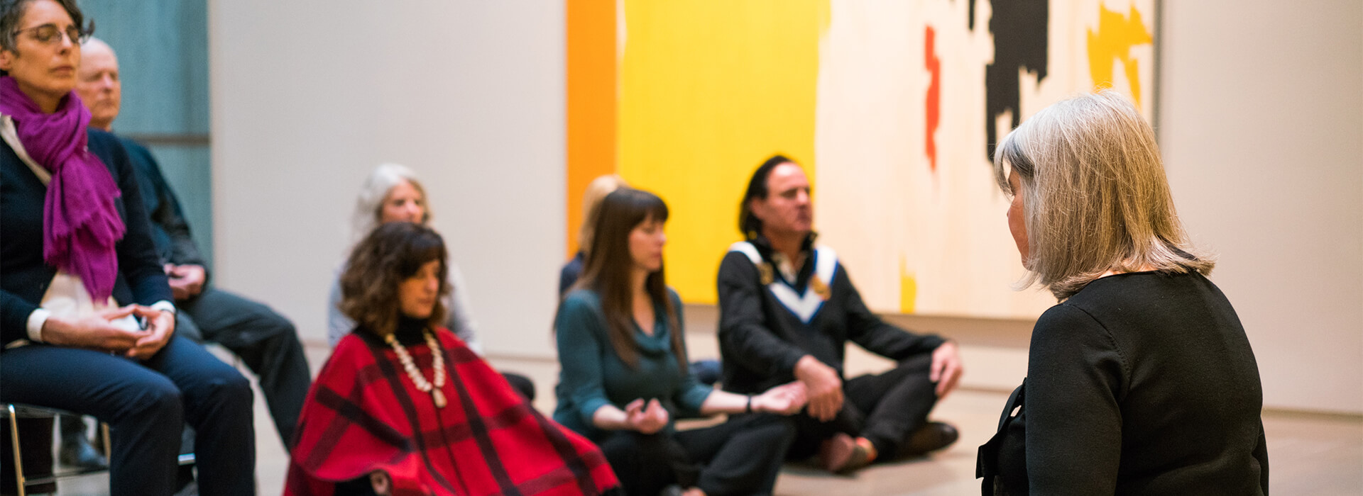 People meditate on the floor of the Clyfford Still Museum galleries