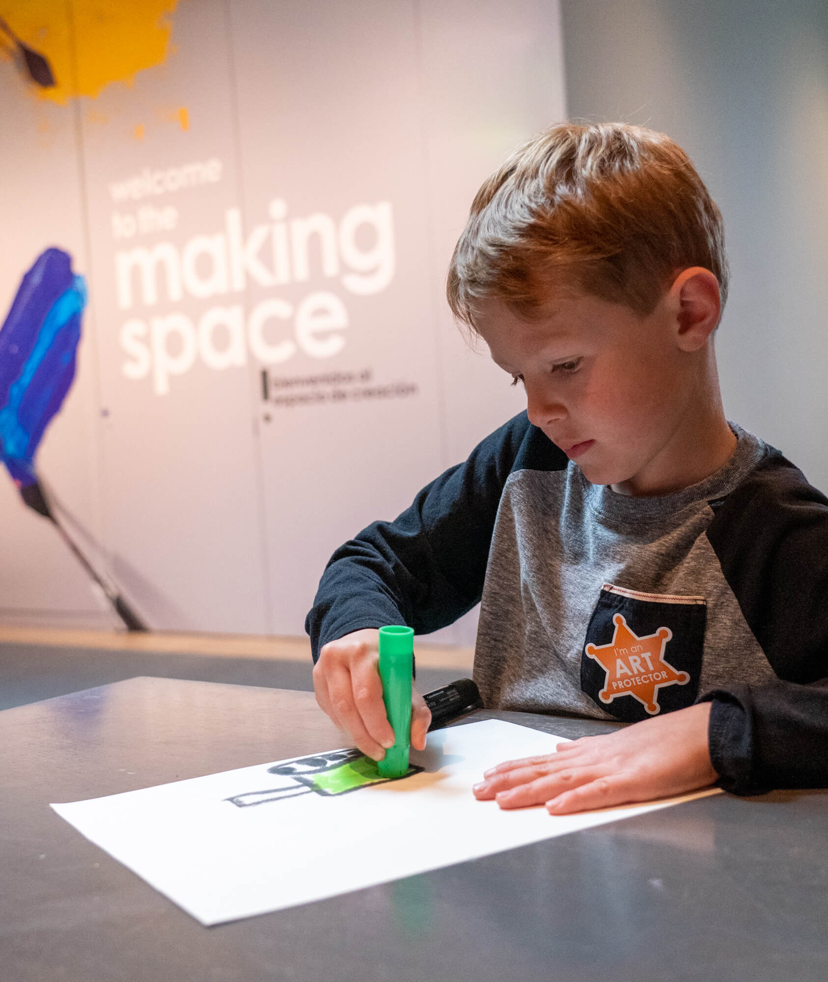 Young children make art in an art studio