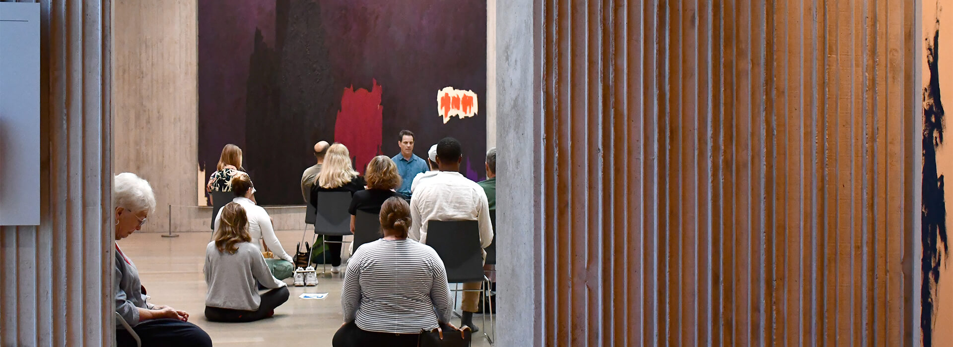 People meditating in an art museum