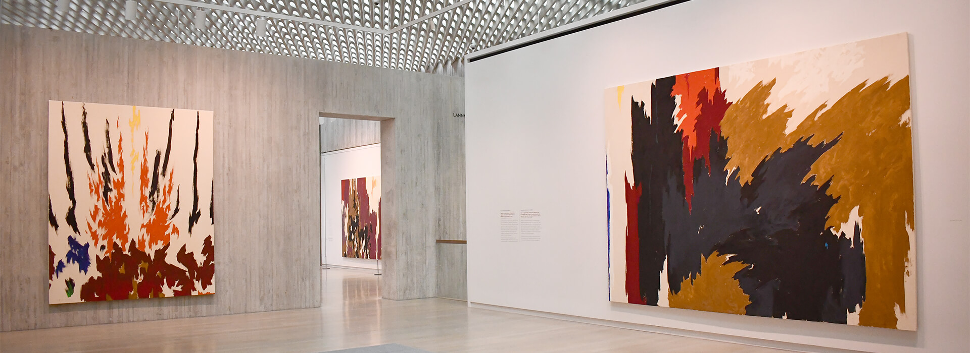 Gallery at the Clyfford Still Museum with large colorful abstract paintings on the walls