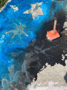Ice chalk melts on a sidewalk