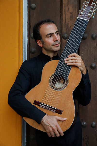 Nicolò Spera with a classical guitar