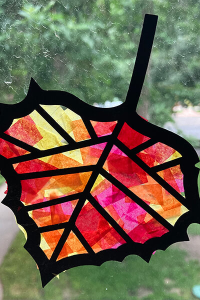 Stained glass fall leaf on a window