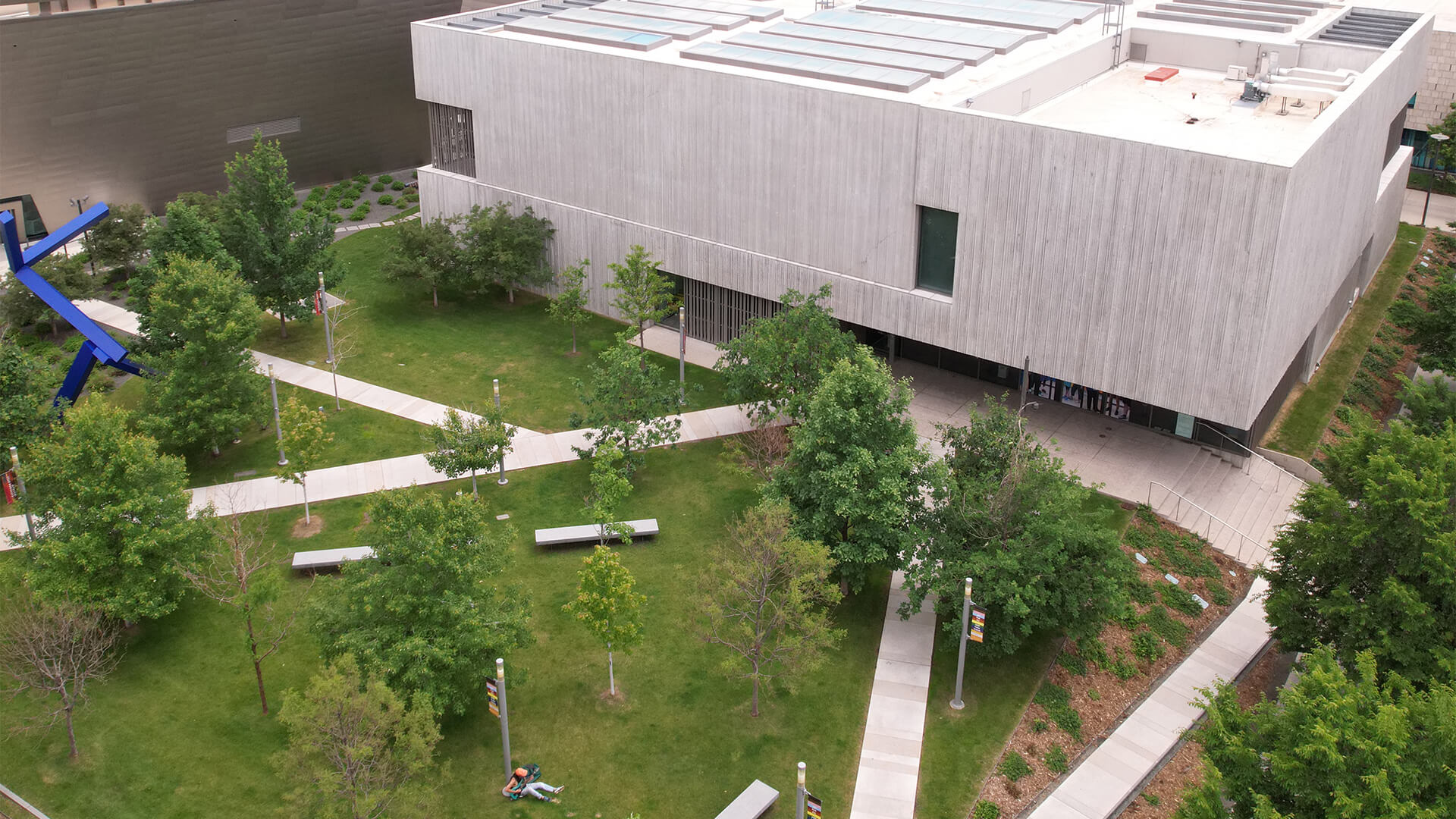 Aerial shot from a drone looking down on the Clyfford Still Museum and outdoor forecourt