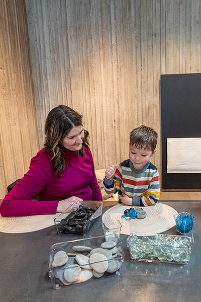 A family makes art out of rocks and glass beads in The Making Space