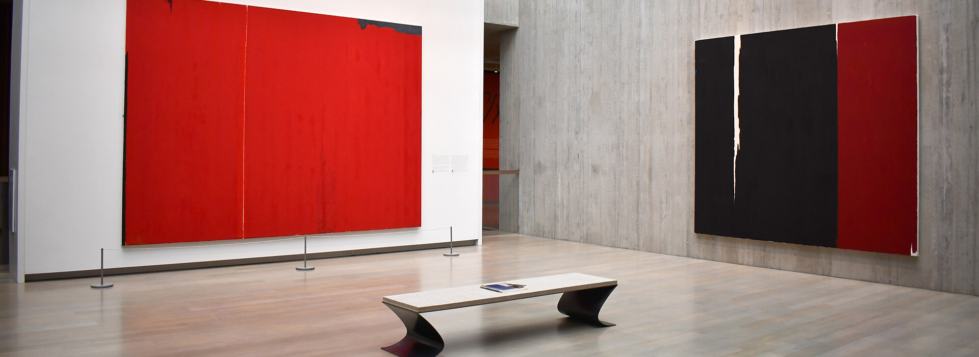 Gallery installation image with red paintings