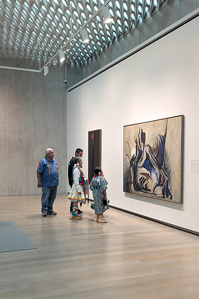 A family looks at art in the Clyfford Still Museum