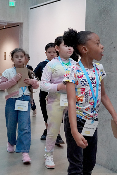 inStill students explore the galleries and walk through a door