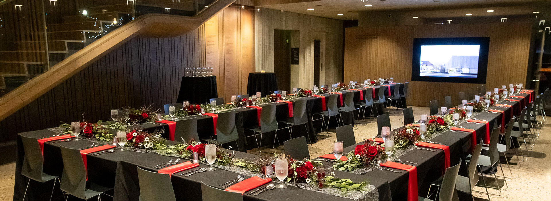 A table is set up and decorated in a lobby