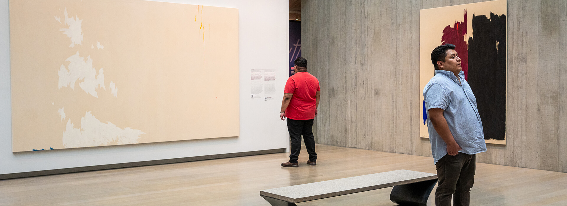 Two men look at art in the Clyfford Still Museum galleries