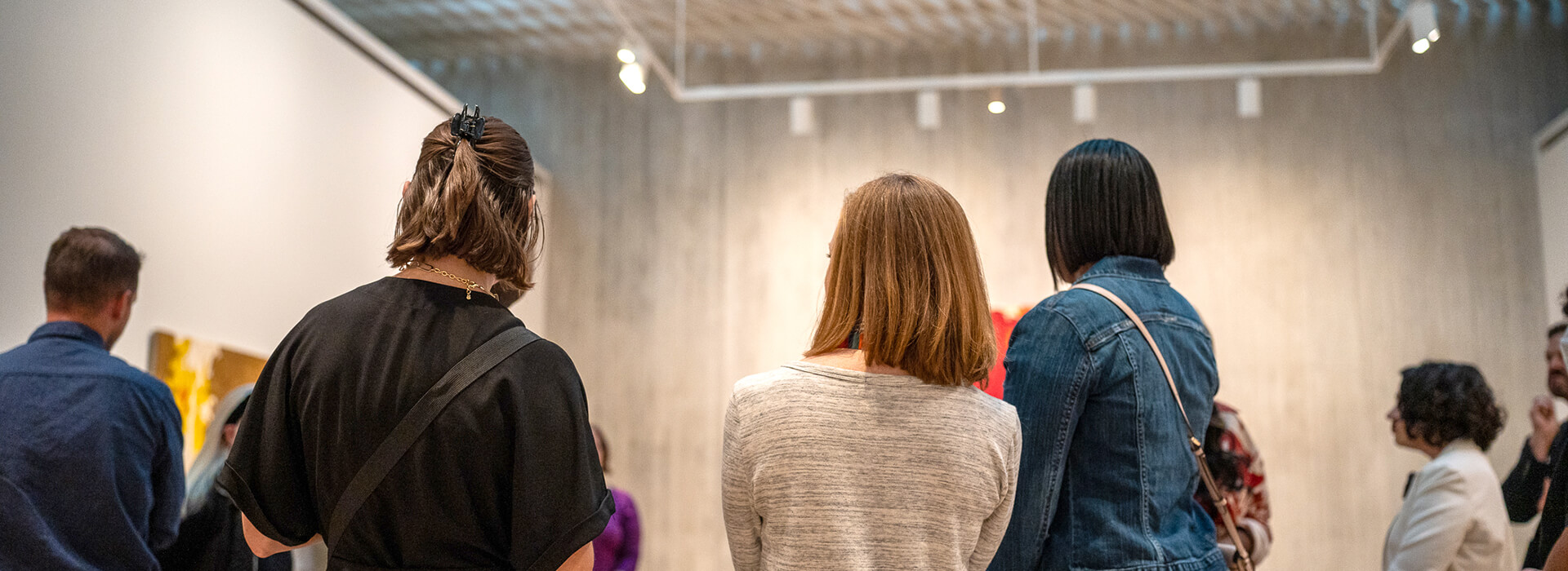 The backs of people in the galleries