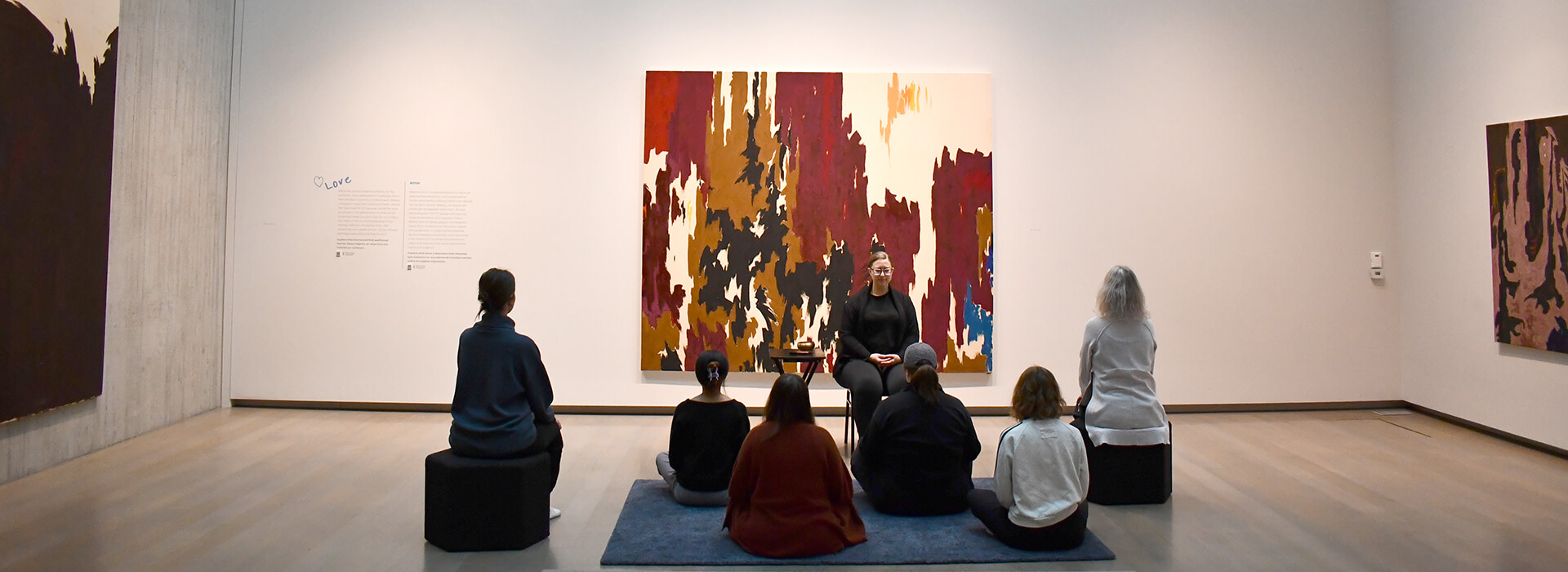 People meditating in a gallery
