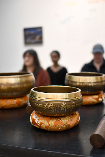 People meditating in a gallery