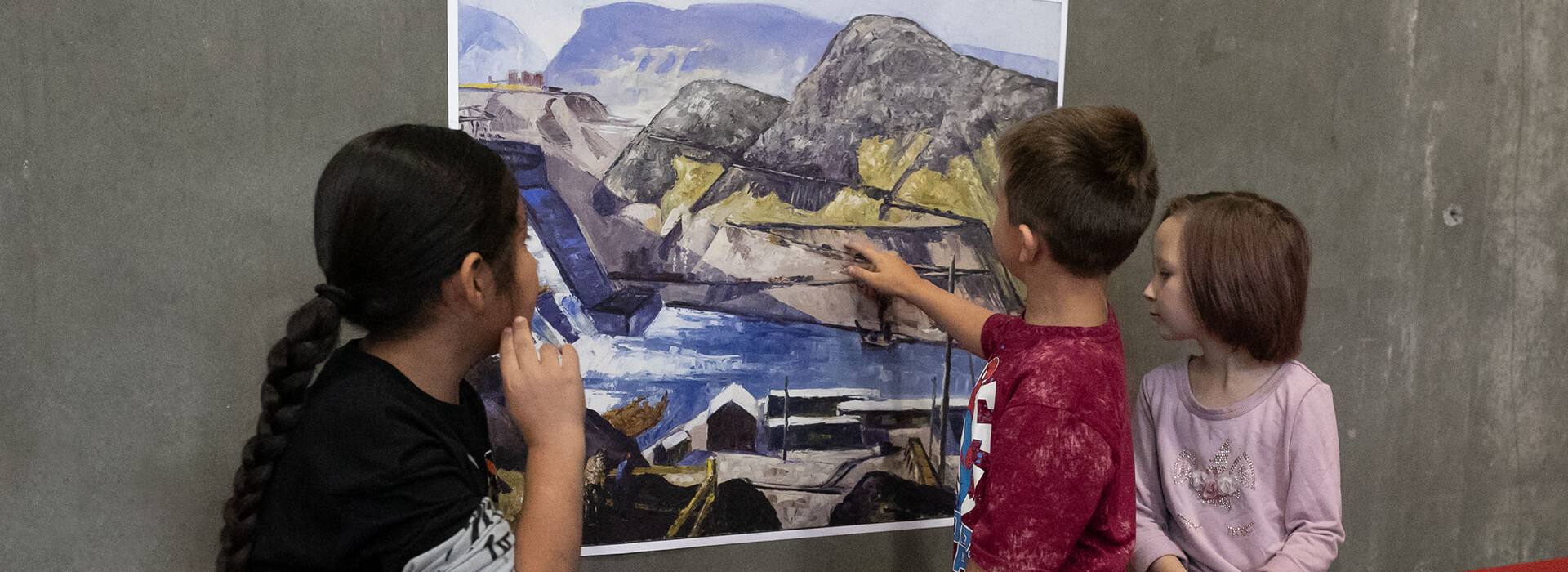Young co-curators look at a copy of Clyfford Still's PH-624