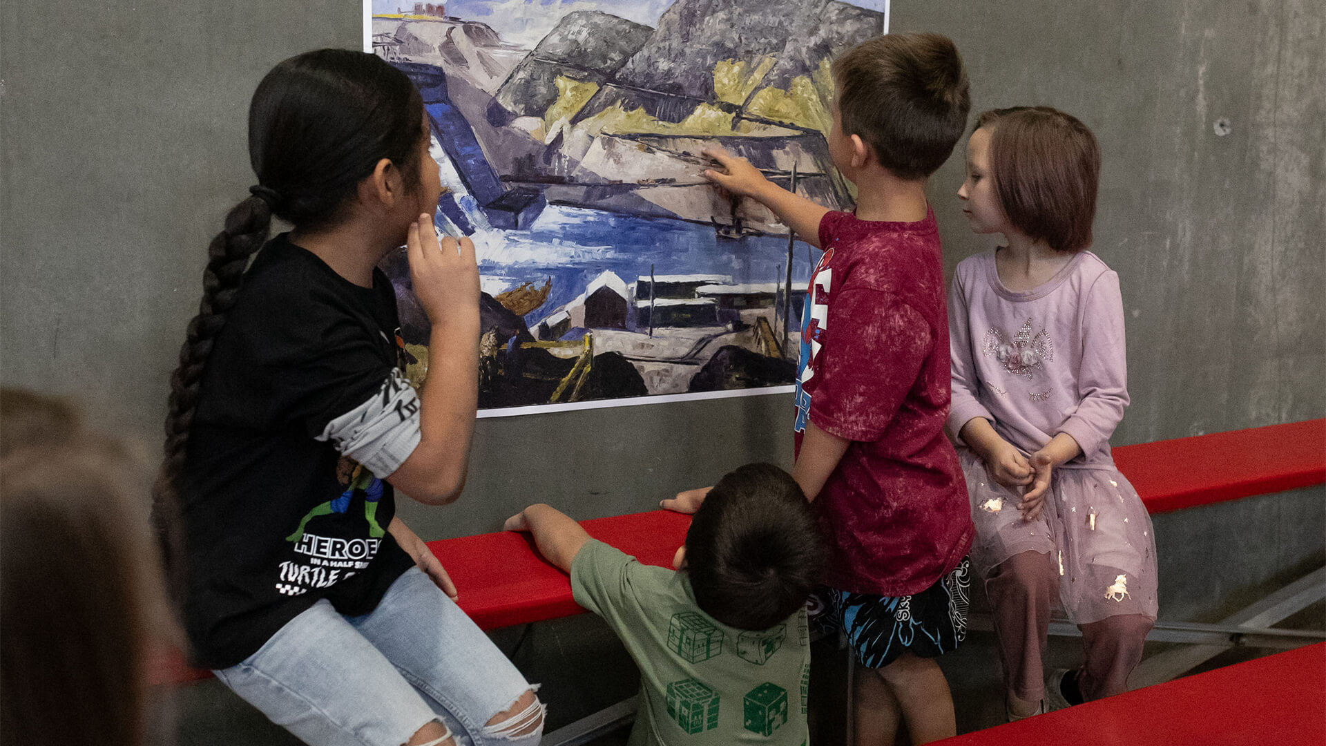 Young co-curators look at a copy of Clyfford Still's PH-624