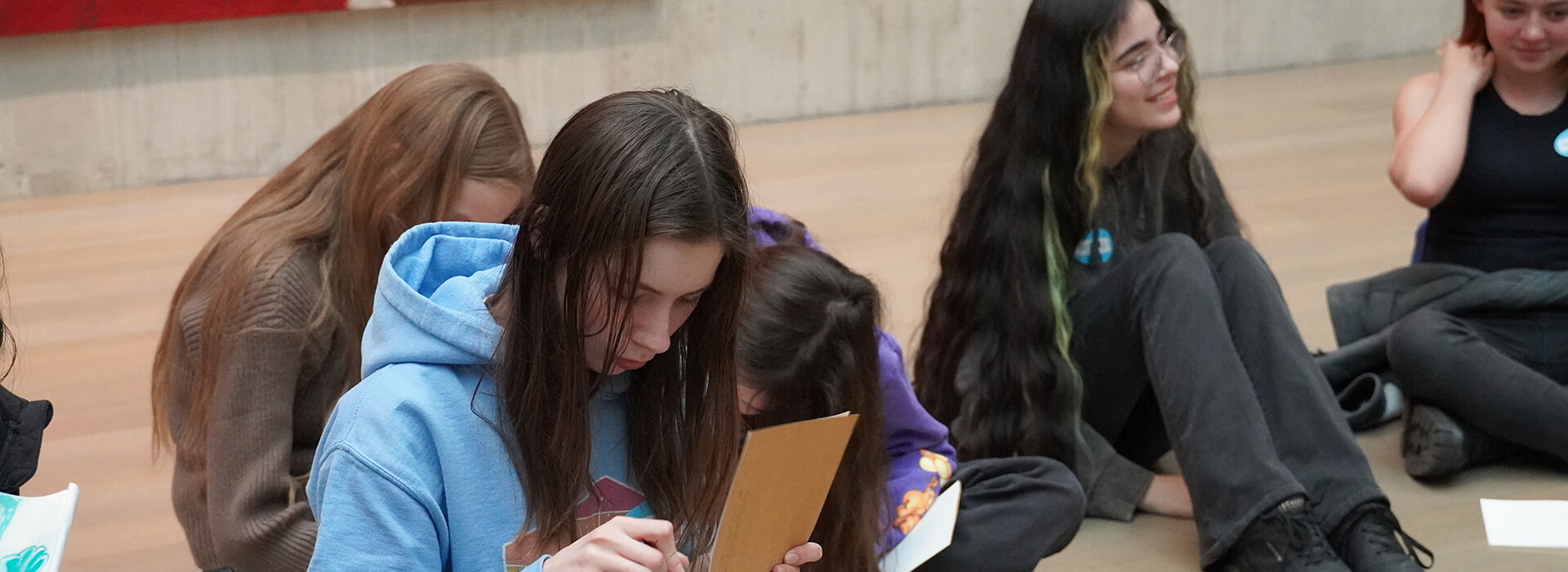 Students sketch in their books