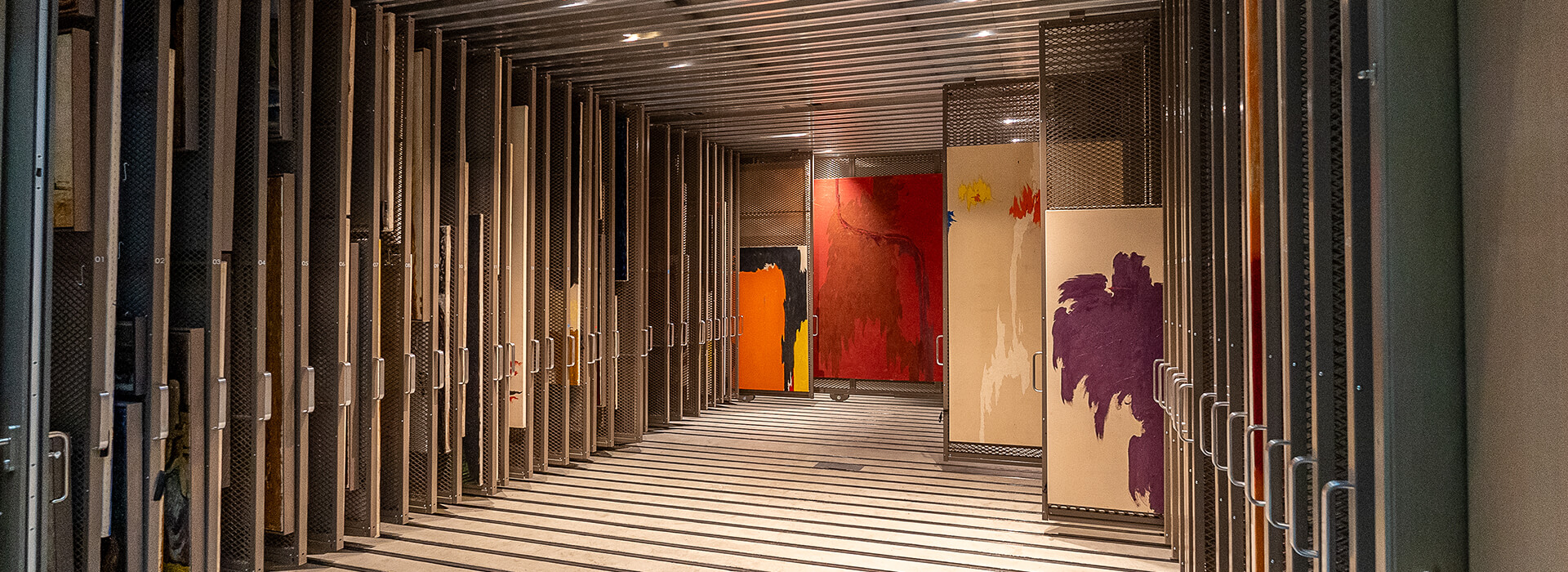 Abstract paintings by Clyfford Still on racks
