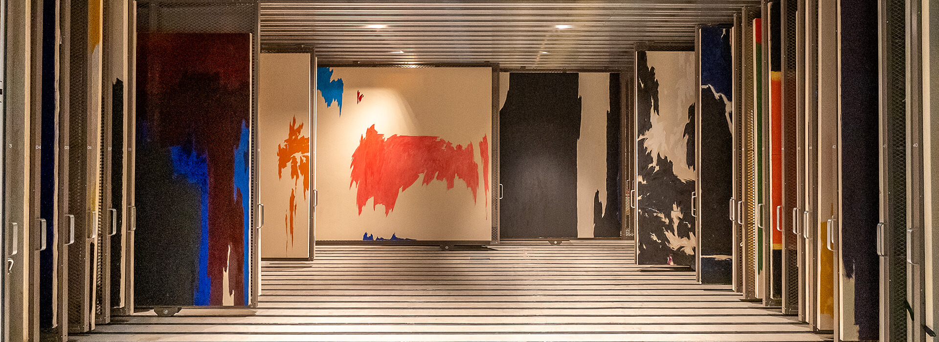 Abstract paintings by Clyfford Still on racks