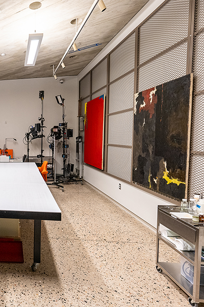 Conservation Lab with paintings on a rack and conservation materials