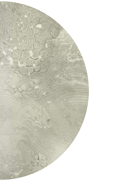 Half of a sumi sound print in a circular shape