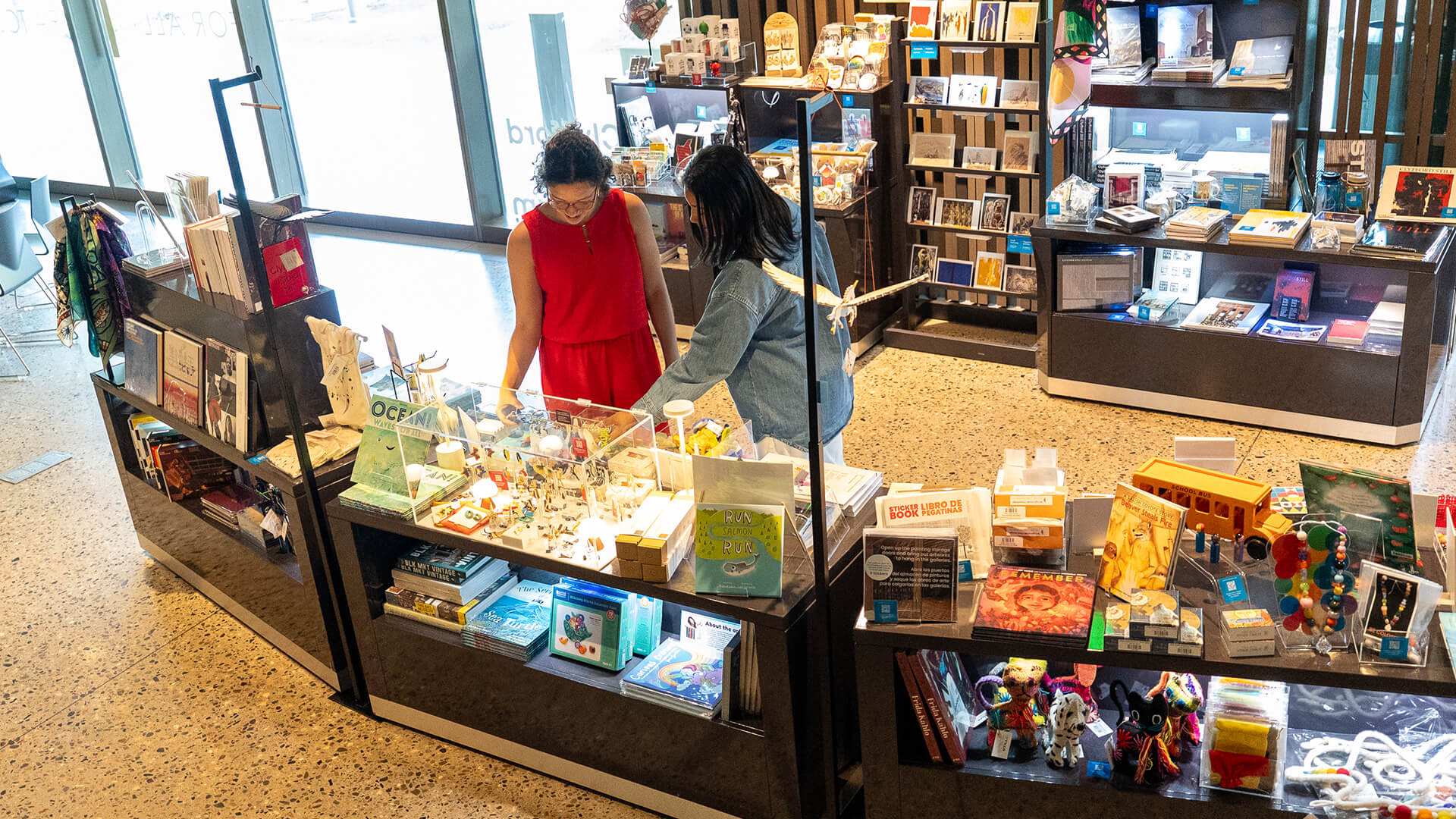 Two women shop in the Clyfford Still Museum Shop