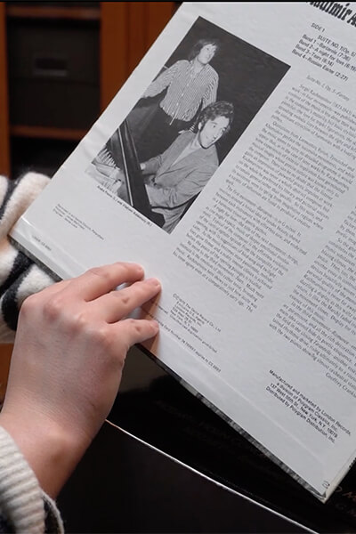 A person holds a record album
